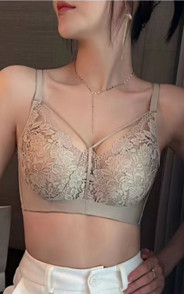 Close-up of model wearing a full-coverage floral lace push-up bra in beige, highlighting intricate lace design and supportive structure.