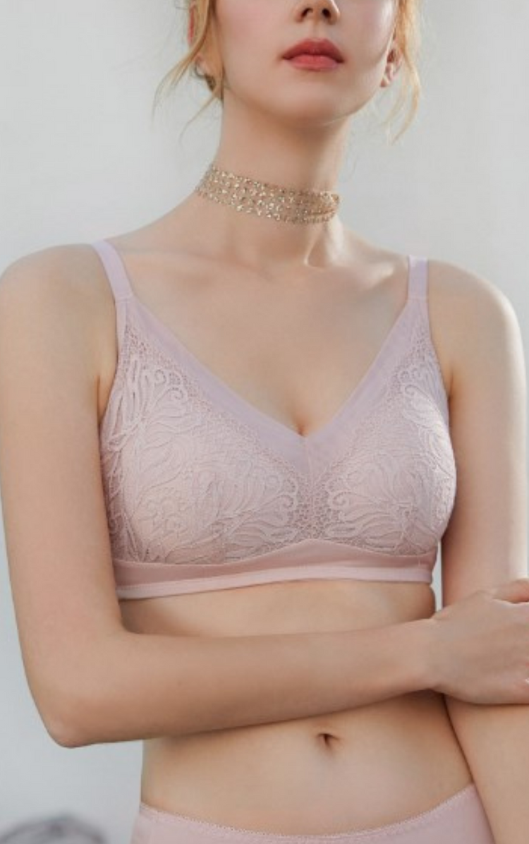 Close-up of a beige wireless contour bra, showing the delicate lace and smooth cup design.